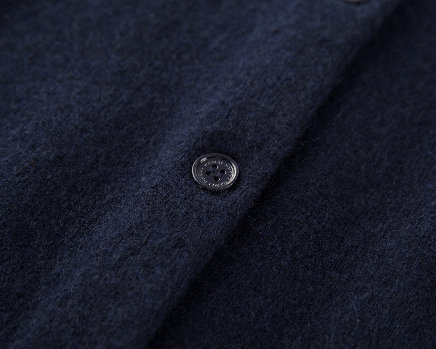 MA06 Cashmere Cardigan by Mawei, navy blue, fabric texture and button details close-up.