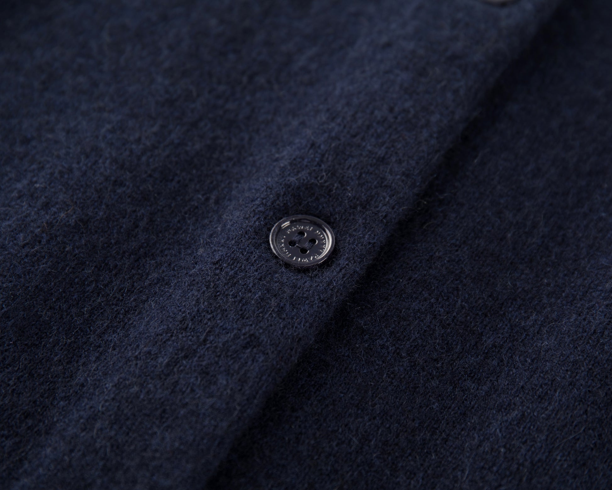 MA06 Cashmere Cardigan by Mawei, navy blue, fabric texture and button details close-up.