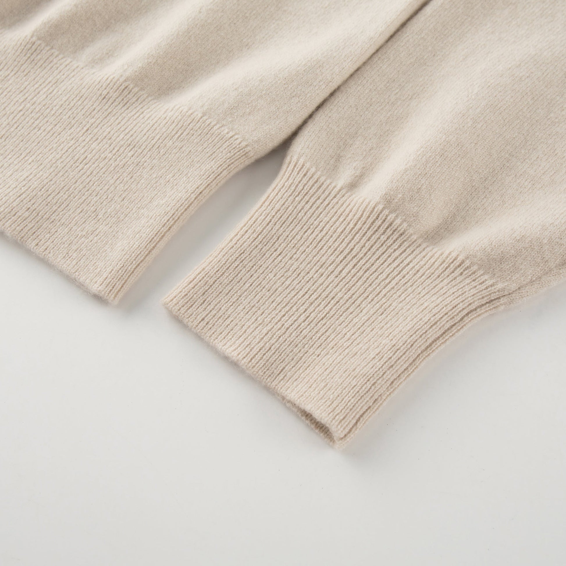 MA06 Cashmere Crewneck Cardigan by Mawei, off white, hem, cuff rib detail close-up.