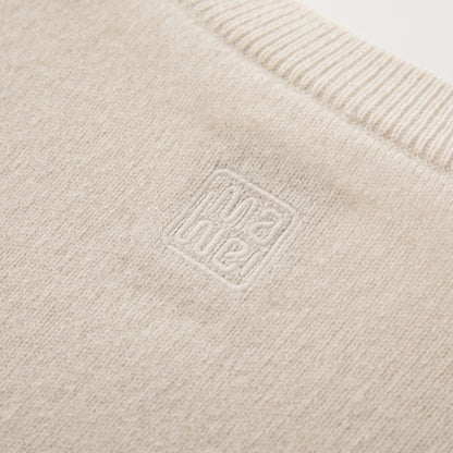 MA06 Cashmere Cardigan by Mawei, off white, fabric and logo embroidery close-up, back view.