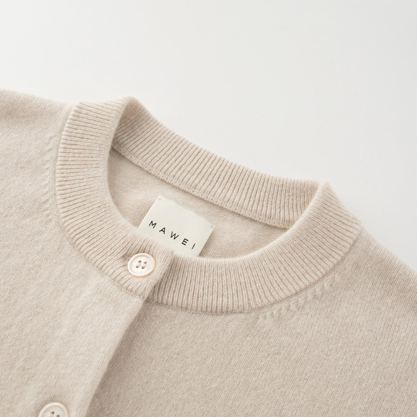 MA06 Cashmere Crewneck Cardigan by Mawei, off white, neck detail close-up.