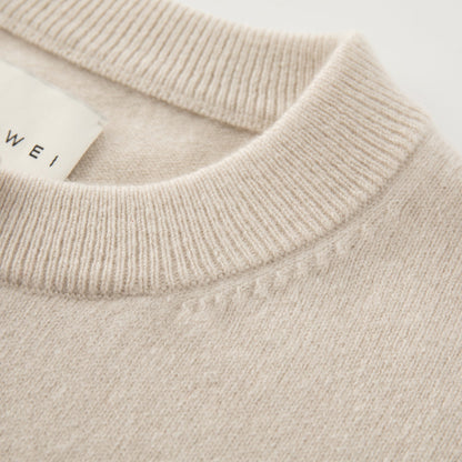 MA06 Cashmere Crewneck Cardigan by Mawei, off white, neck detail close-up.