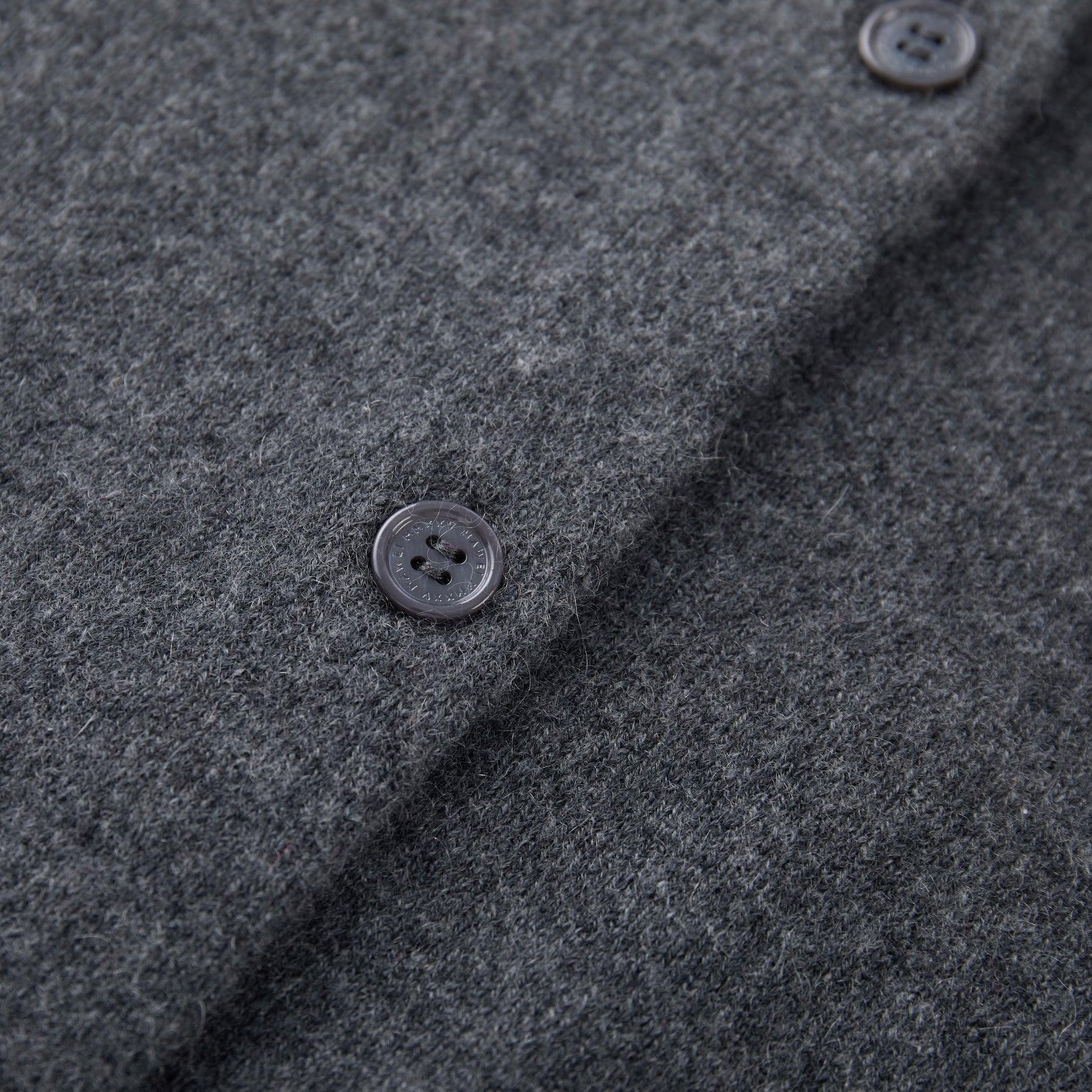 MA06 Cashmere Crewneck Cardigan by Mawei, grey, button details close-up.