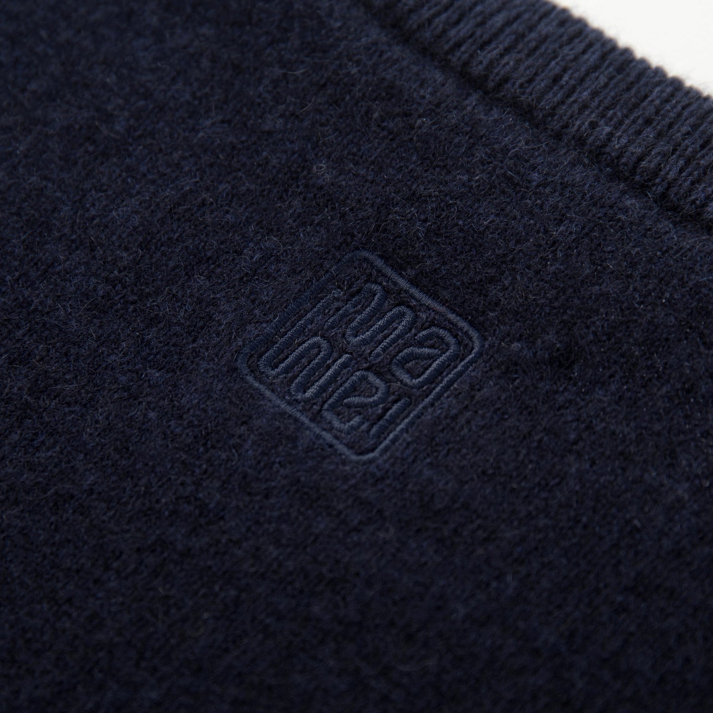 MA07  Cashmere Short Sleeve Crewneck  Sweater by Mawei, navy blue, fabric and logo embroidery  close-up, back view.
