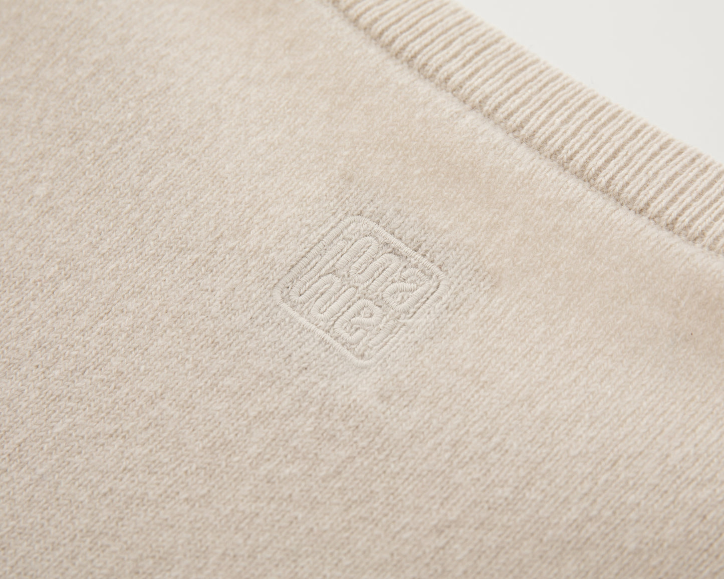 MA07 Short Sleeve Oversized Cashmere  Crewneck  Sweater by Mawei, off-white,  embroidery close up, back view.
