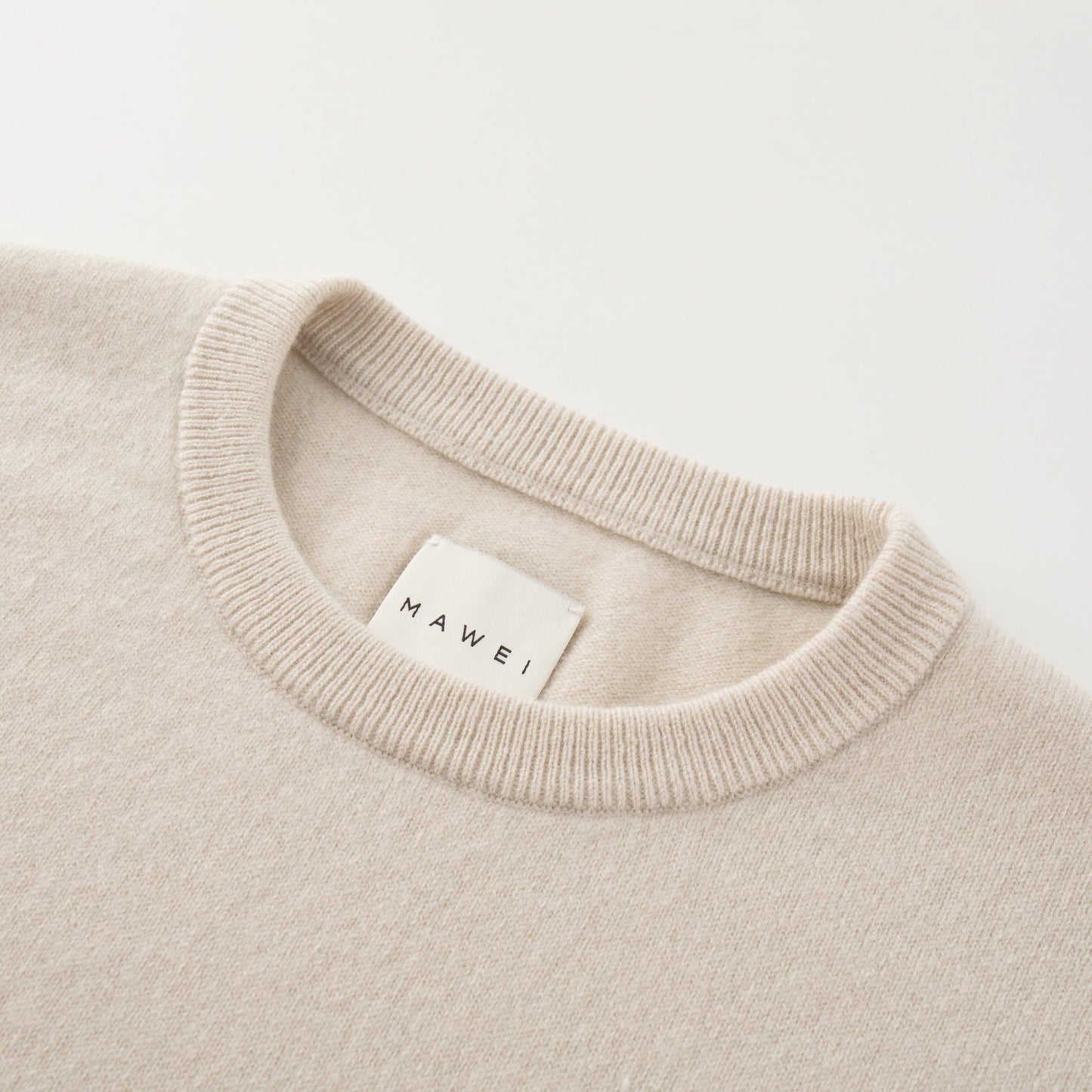 MA07 Cashmere Short Sleeve Crewneck Sweater by Mawei,  off white, neck rib close-up.