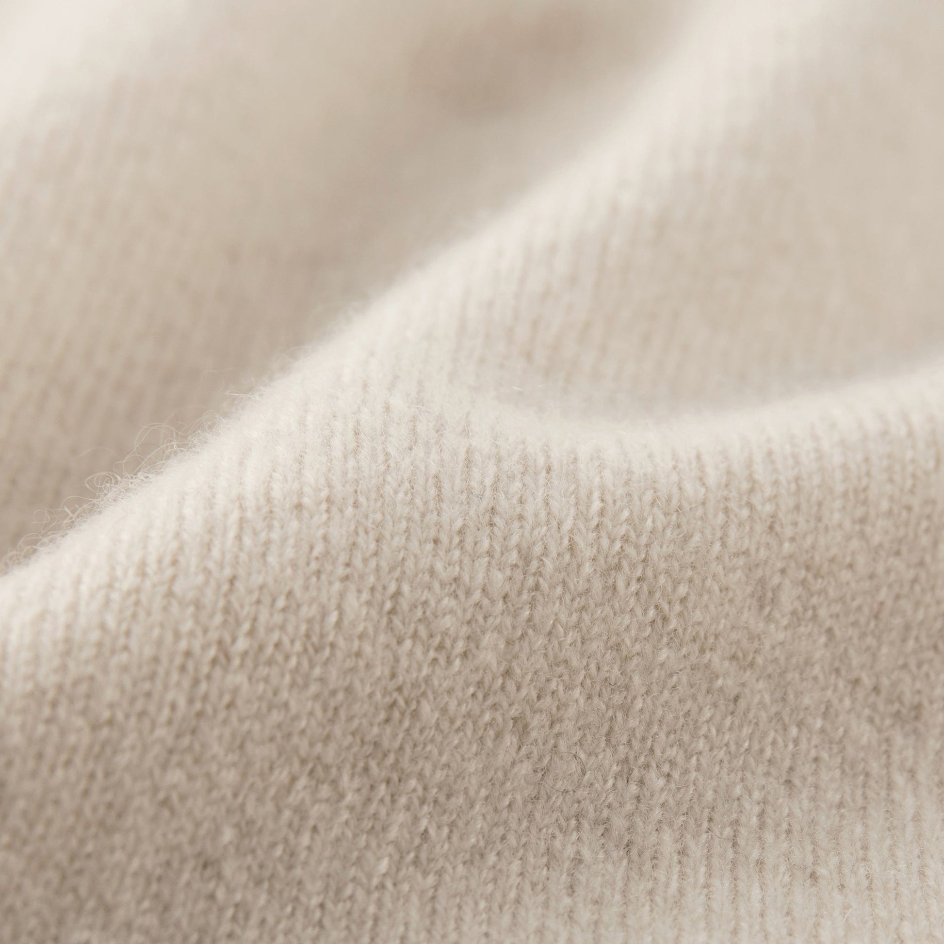 MA07  Cashmere Short Sleeve Crewneck Sweater by Mawei by Mawei, off white, fabric texture close-up.