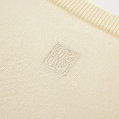 MA08 Oversized Cashmere  V-neck  Sweater by Mawei, yellow, fabric and logo embroidery close up, back view.