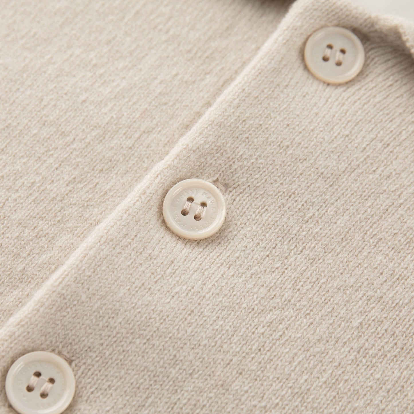 MA09 Cashmere Short Sleeve Polo Sweater by Mawei, off white, buttons close up
