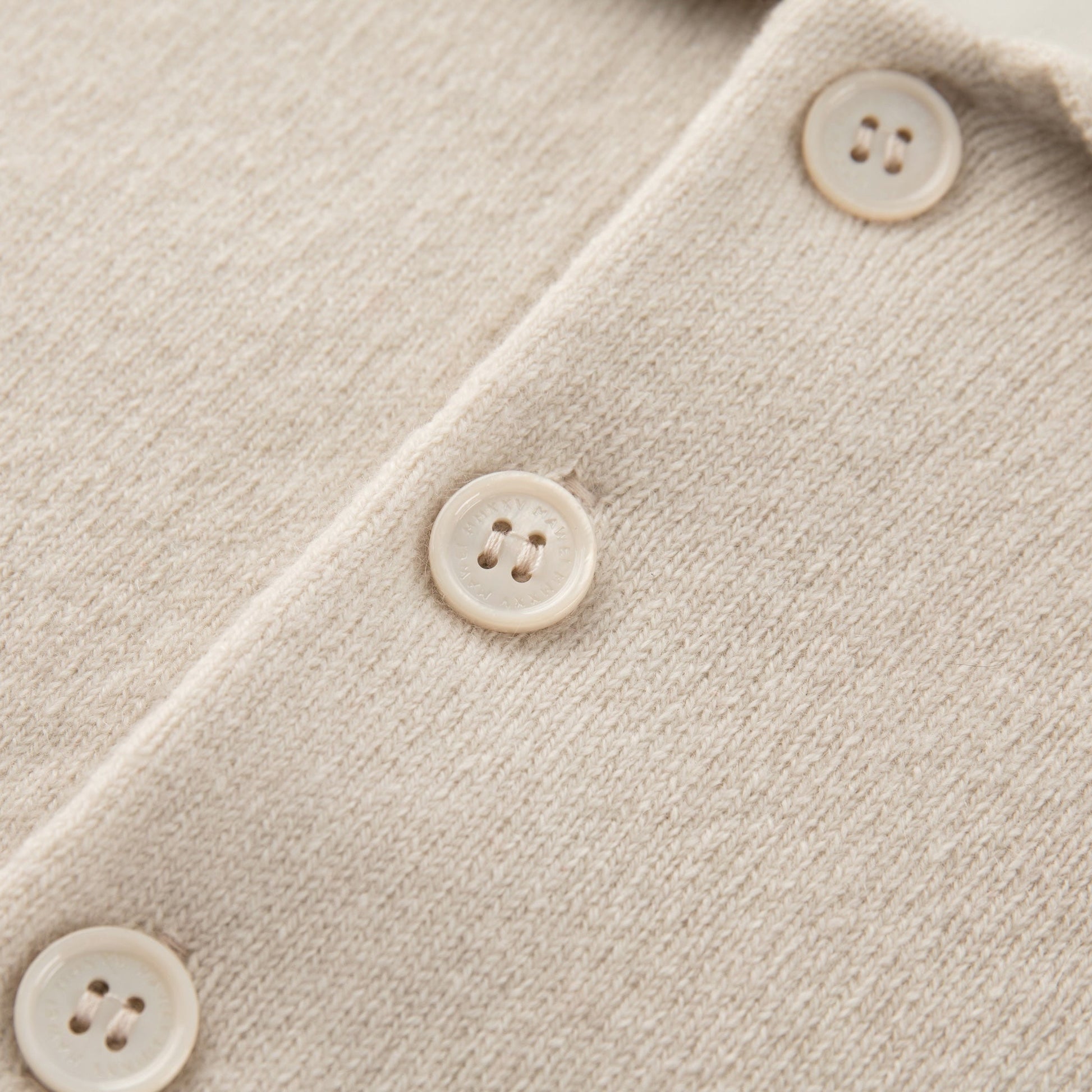 MA09 Cashmere Short Sleeve Polo Sweater by Mawei, off white, buttons close up