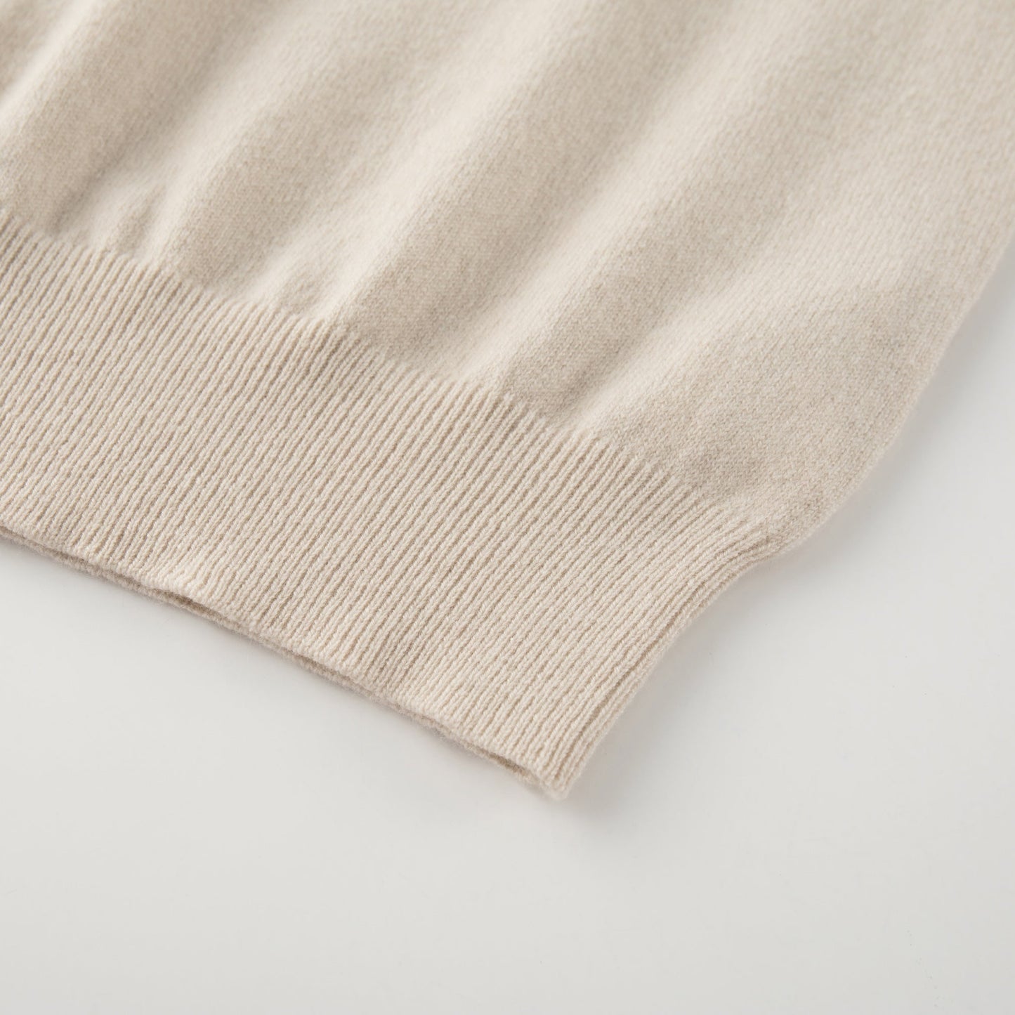 MA09 Cashmere Short Sleeve Polo Sweater by Mawei, off white, hem rib close up.
