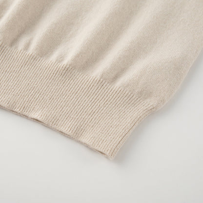 MA09 Cashmere Short Sleeve Polo Sweater by Mawei, off white, hem rib close up.