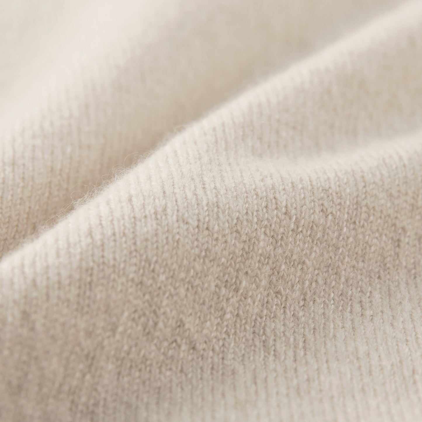 MA09 Cashmere Short Sleeve Polo Sweater by Mawei, off white, fabric texture close up.