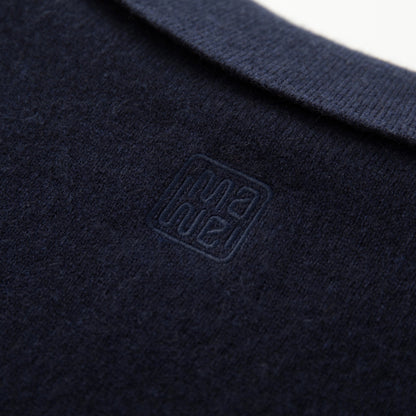MA09 Cashmere Short Sleeve Polo Sweater by Mawei, navy blue, fabric and logo embroidery close up, back view.