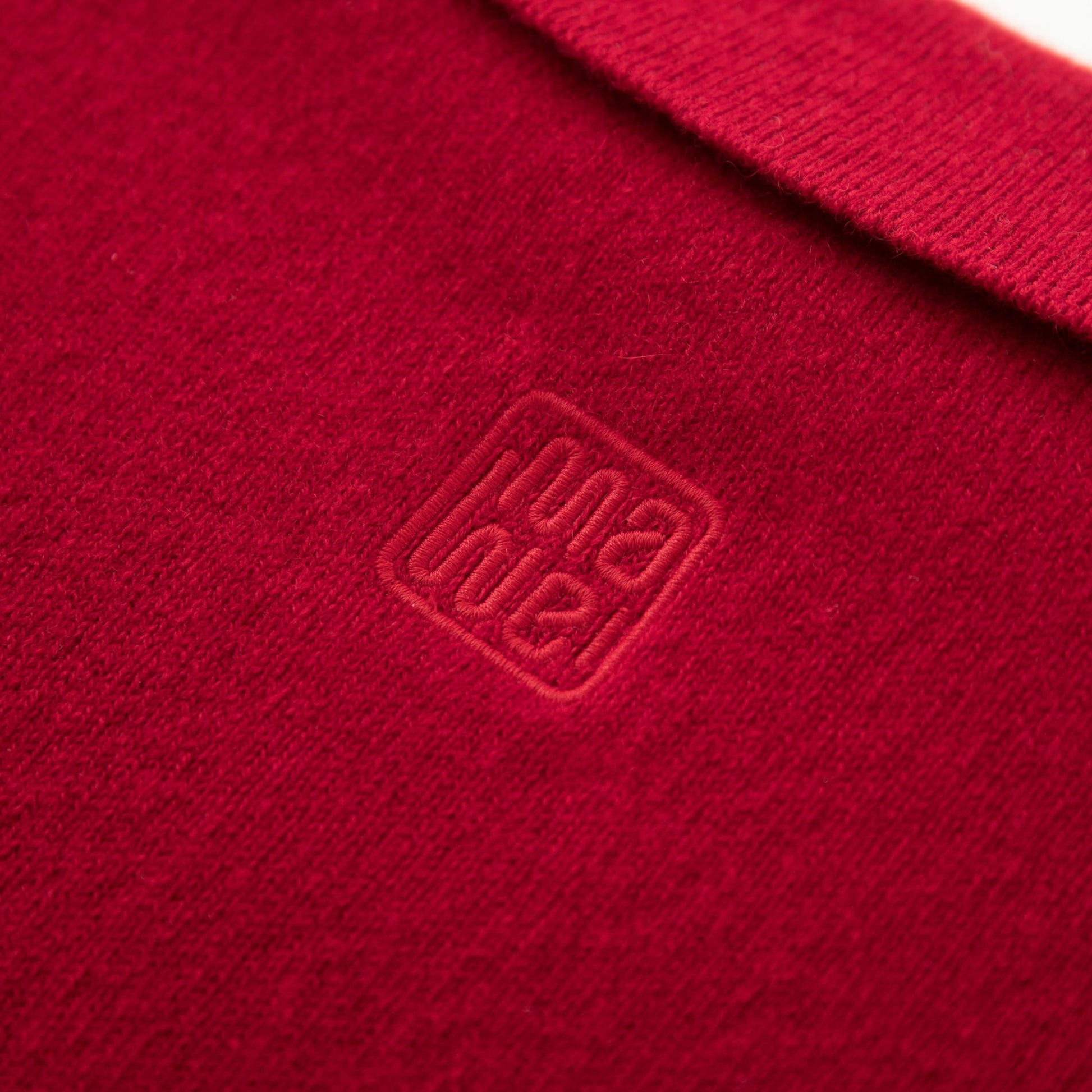 MA09 Cashmere Short Sleeve Polo Sweater by Mawei, red, fabric and logo embroidery close up, back view.
