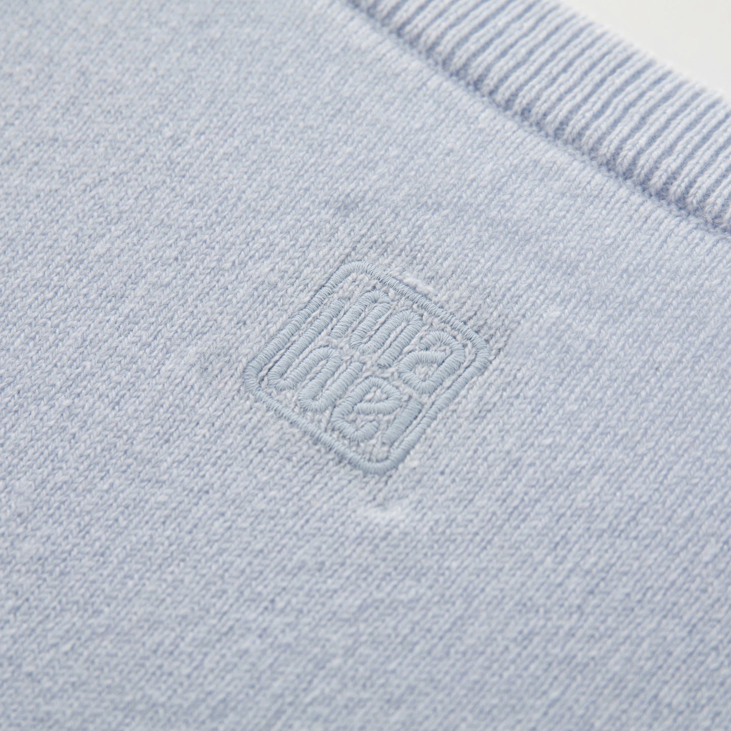 MA22 Cashmere Crewneck Sweater by Mawei, blue, fabric and embroidery detail close-up, back view.