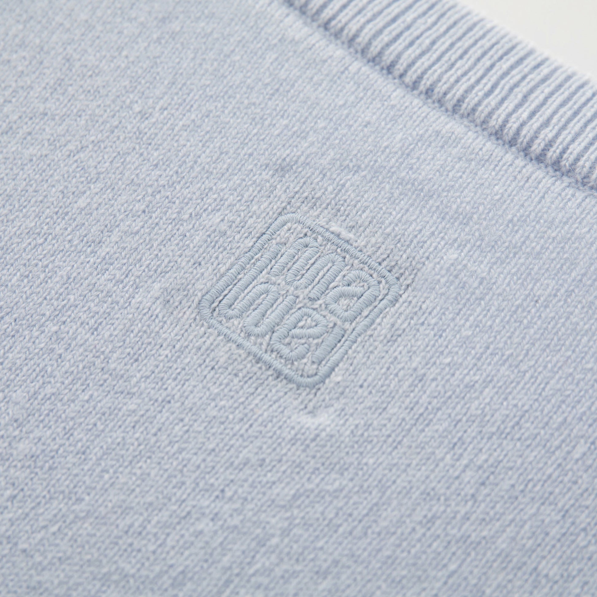 MA22 Cashmere Crewneck Sweater by Mawei, blue, fabric and embroidery detail close-up, back view.