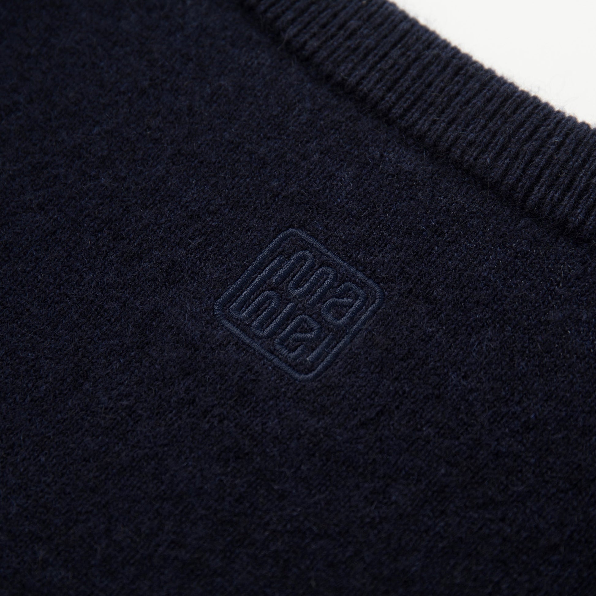 MA22 Cashmere Crewneck Sweater by Mawei, navy blue, fabric and embroidery detail close-up, back view.
