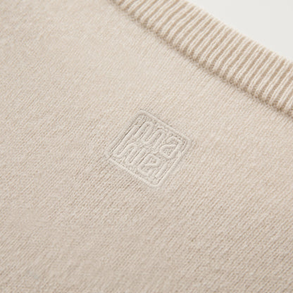 MA22 Cashmere Crewneck Sweater by Mawei, off white, fabric and embroidery detail close-up.