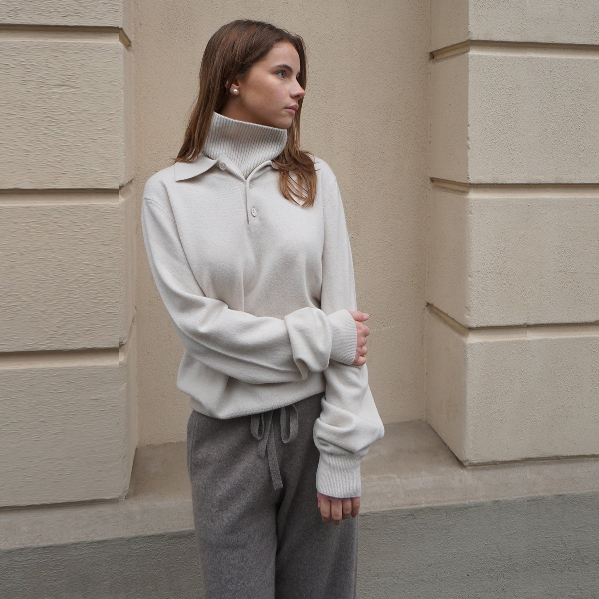 MA44 Cashmere Trousers, grey brown, and MA25 Cashmere Polo Sweater,  off white by Mawei, front view, female model.