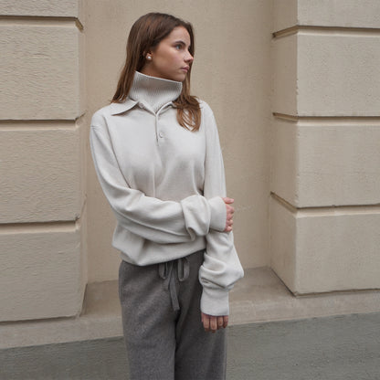 MA44 Cashmere Trousers, grey brown, and MA25 Cashmere Polo Sweater,  off white by Mawei, front view, female model.