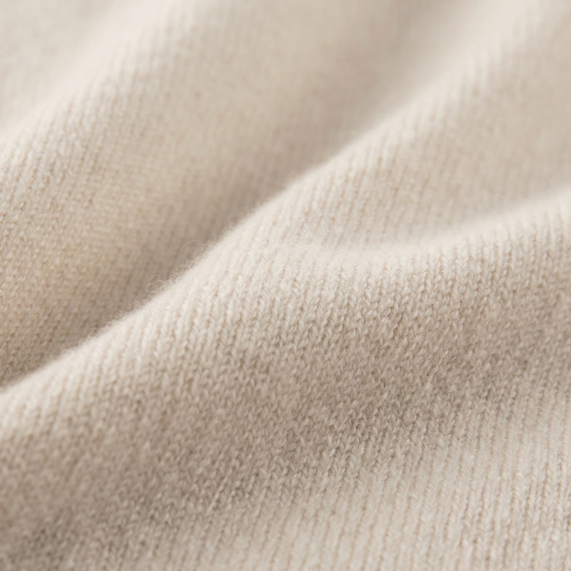 MA44 Cashmere Trousers with pockets by Mawei, off white, fabric texture close-up.