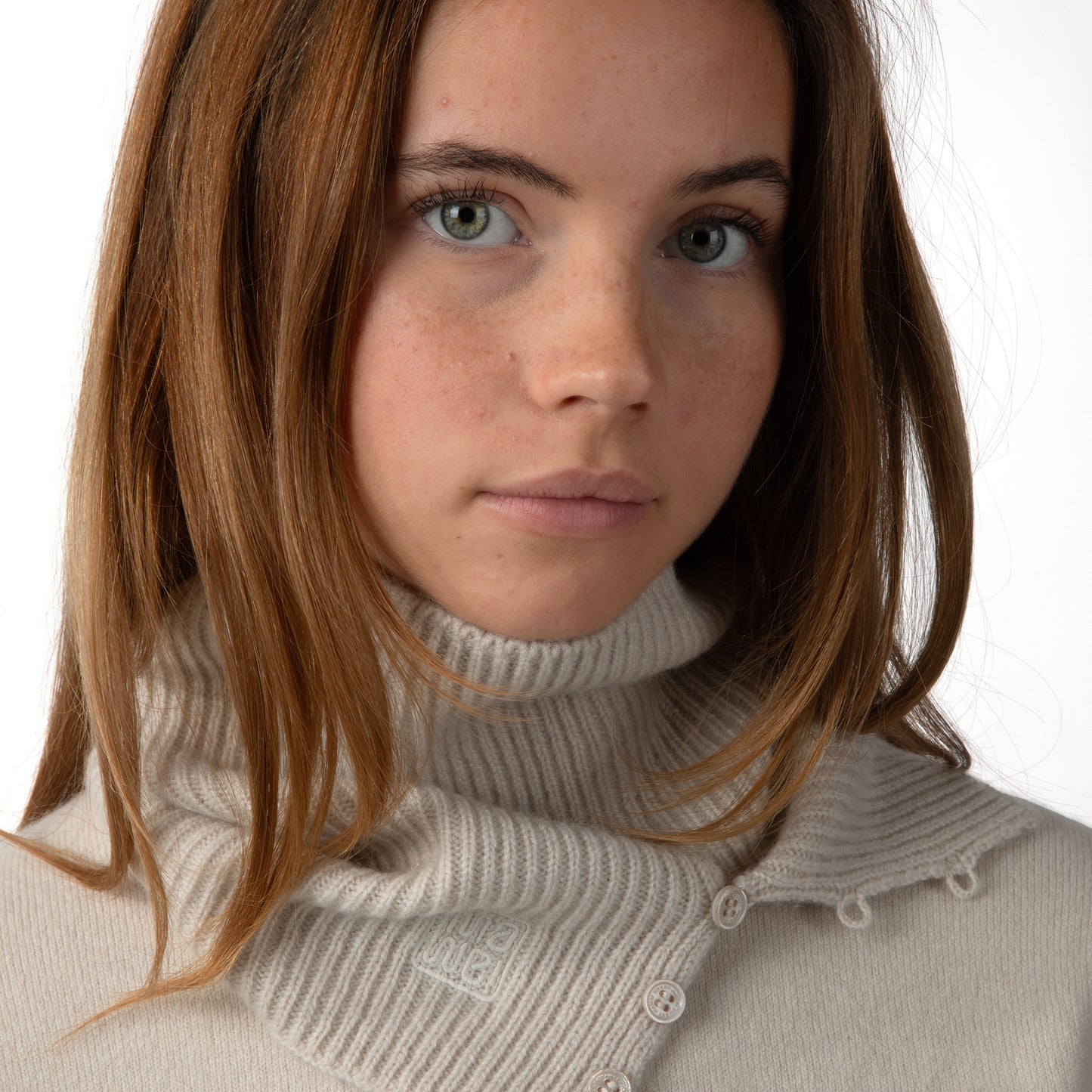 MA61 Cashmere Buff with Buttons by Mawei, off white, front view, female model.