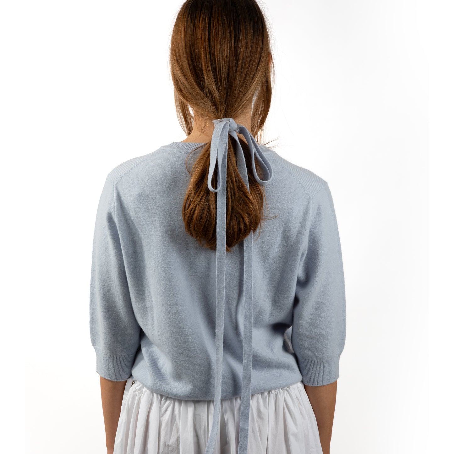 MA03 Cashmere Short Sleeve  Crewneck Sweater by Mawei, blue, with MA91 cashmere ribbon blue, back view, female model