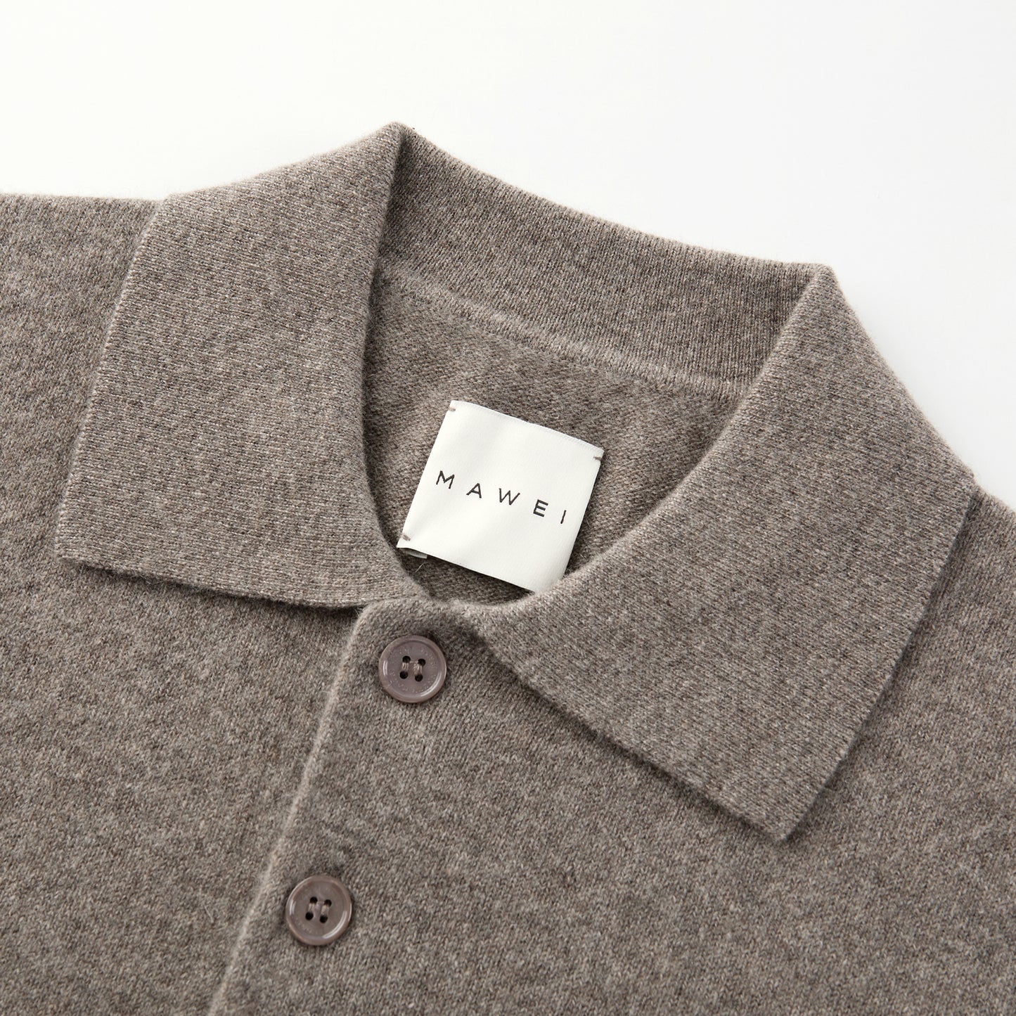 MA25 Cashmere Polo Sweater by Mawei, grey-brown, fabric texture, buttons, collar details close-up.