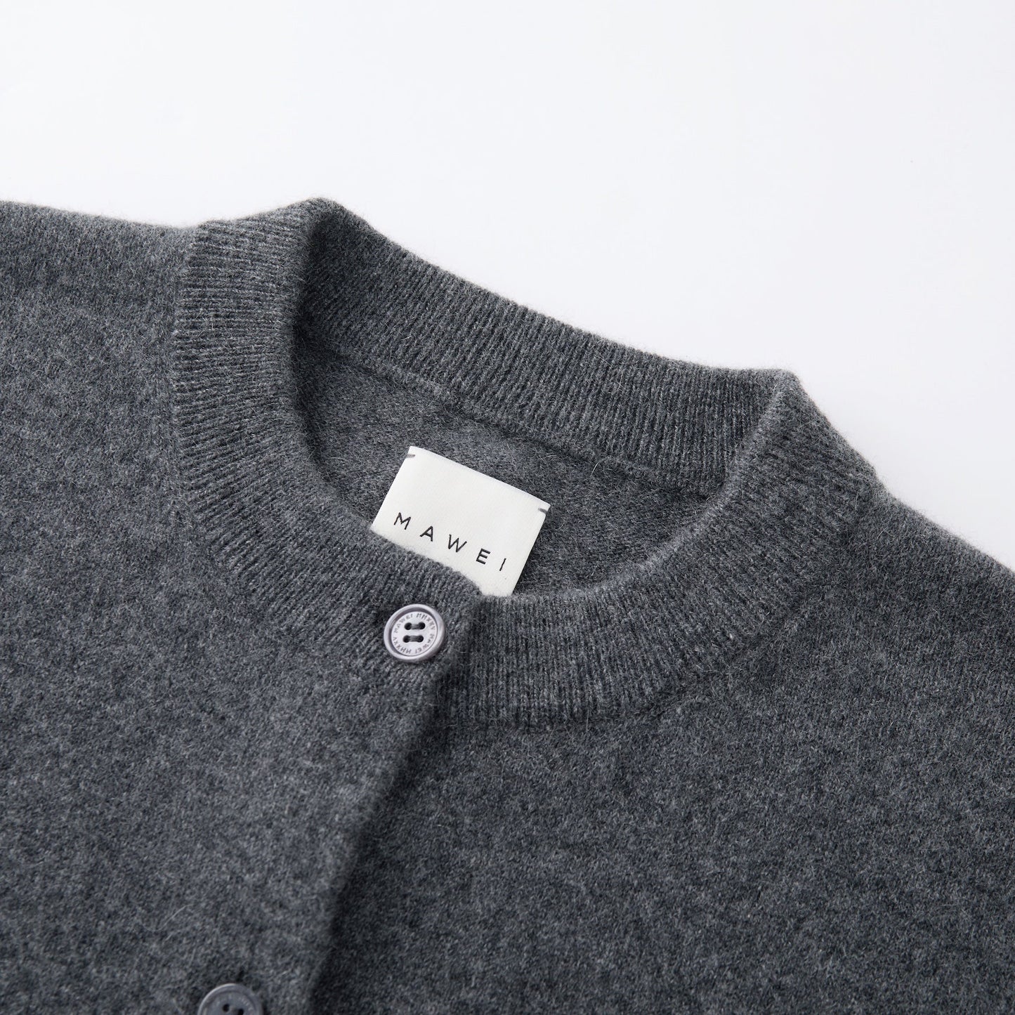 MA06 Cashmere Crewneck Cardigan by Mawei, grey,  neck, rib, button details close-up.