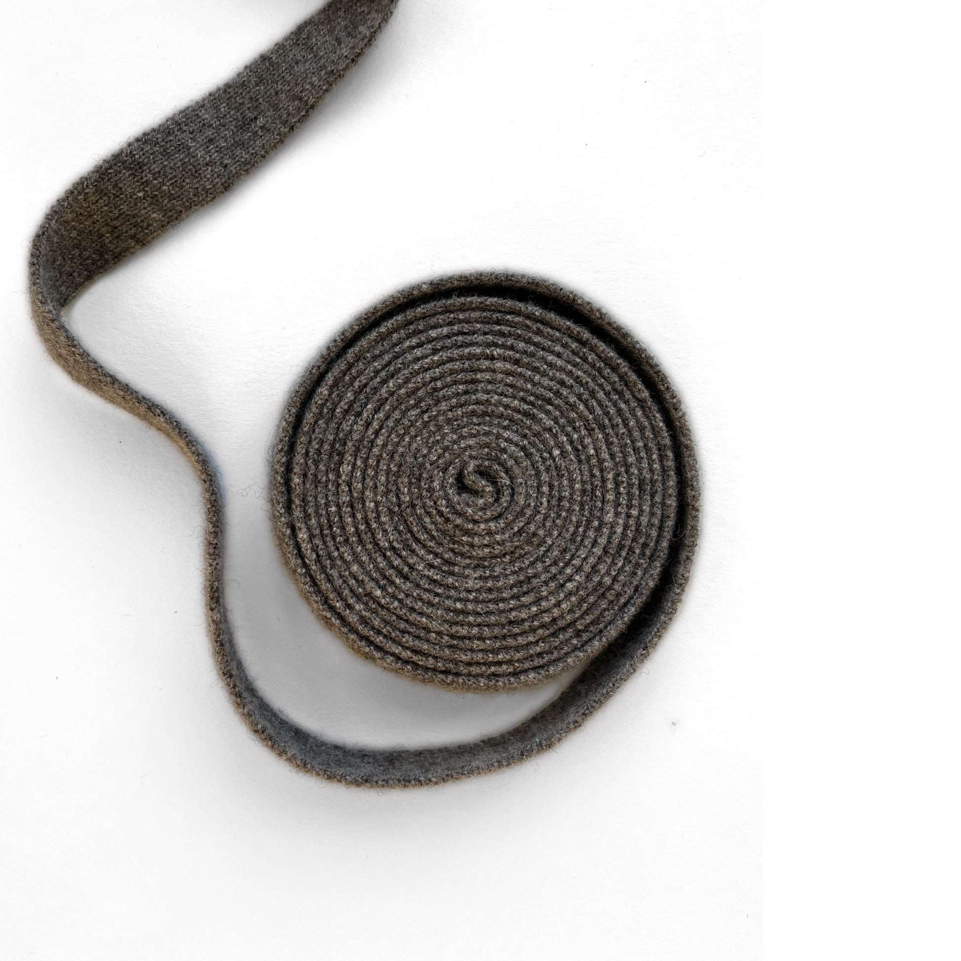 MA91 Cashmere Ribbon by Mawei, brown and grey, roll, belt, hair band, hair string, close up.