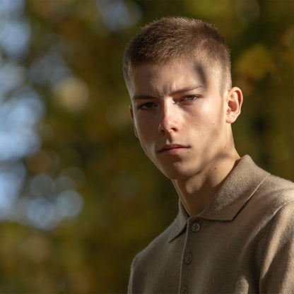 MA25 Cashmere Polo Sweater by Mawei, beige camel, side view, male model.