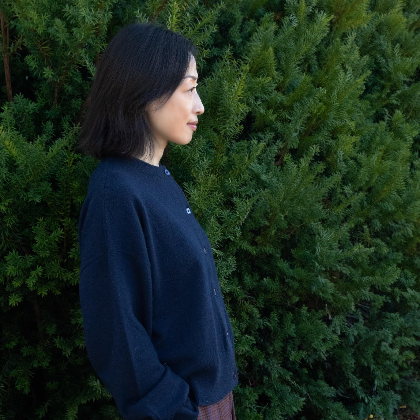 MA06 Cashmere Crewneck Cardigan by Mawei, navy blue, side view, female model.