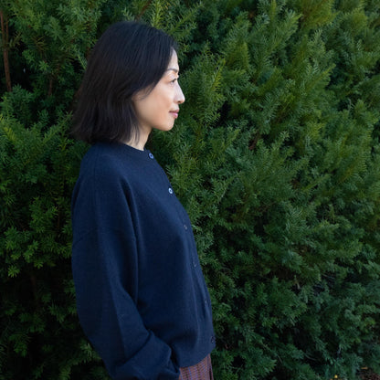 MA06 Cashmere Crewneck Cardigan by Mawei, navy blue, side view, female model.